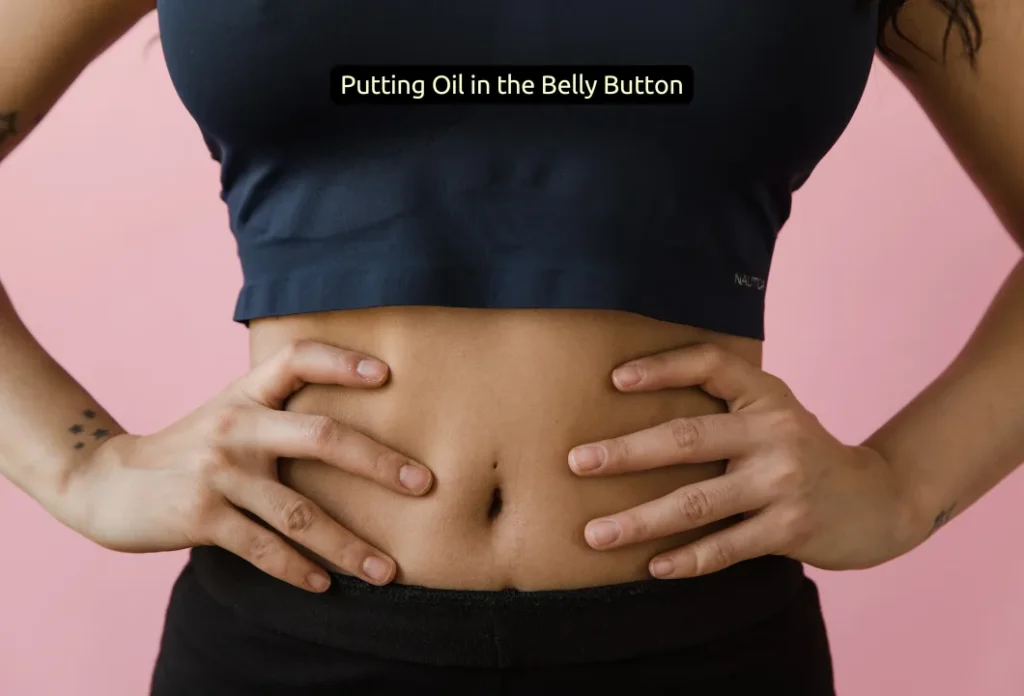 Putting Oil in the Belly Button (1)